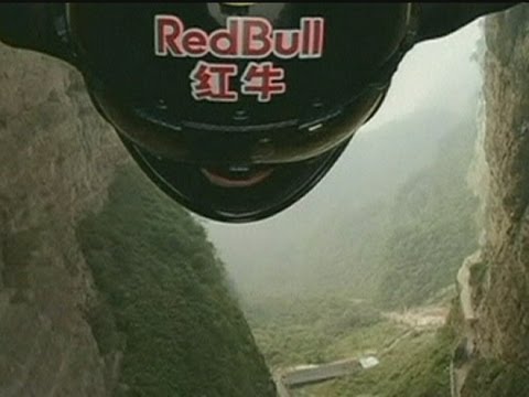 INCREDIBLE: Jeb Corliss wingsuit skydiver flies through mountain cave